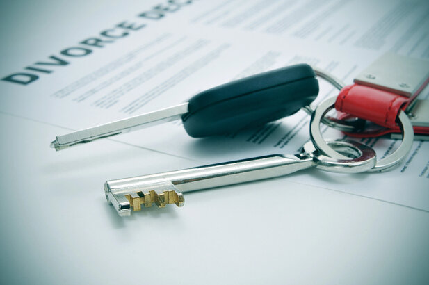 Legal professional reviewing property and asset documents in an office