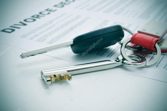 Legal professional reviewing property and asset documents in an office