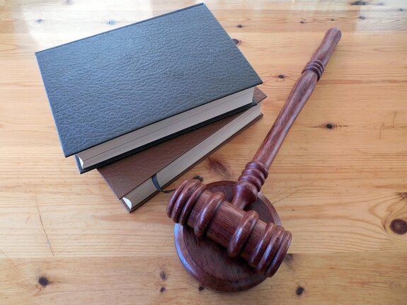 Client and attorney reviewing prior court orders for possible modification